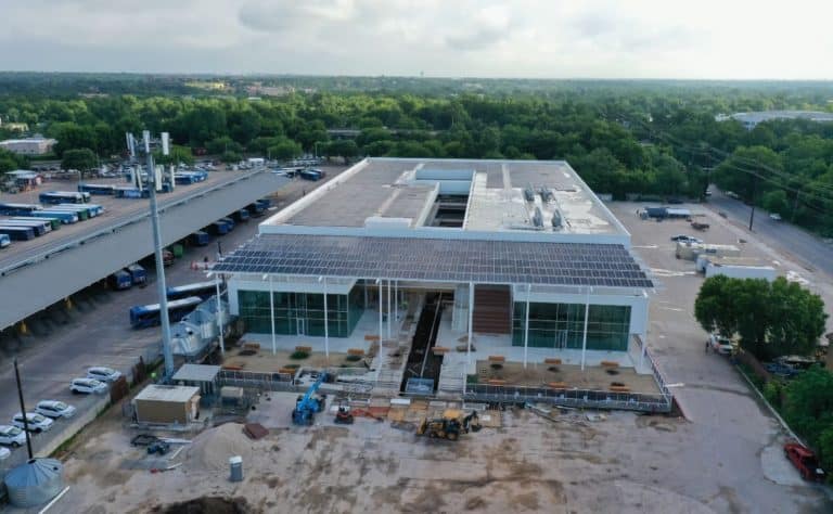 Front view of building construction 3423 Holdings with solar panels on the roof